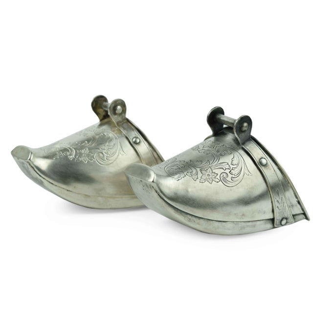 These exquisite antique silver-plated stirrups are a testament to the craftsmanship of the Spanish Colonial period. Hand-...