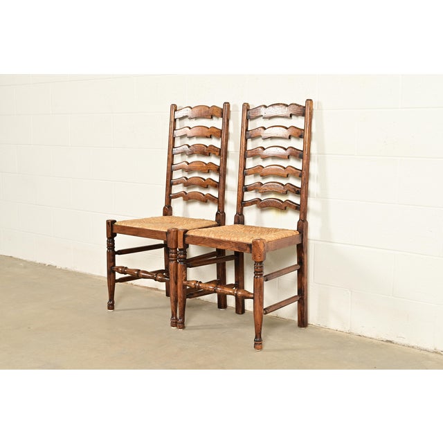 Baker Furniture Company Baker Furniture Style English Country Rustic Carved Solid Oak Ladder Back Dining Chairs With Rush Seats, Pair For Sale - Image 4 of 13