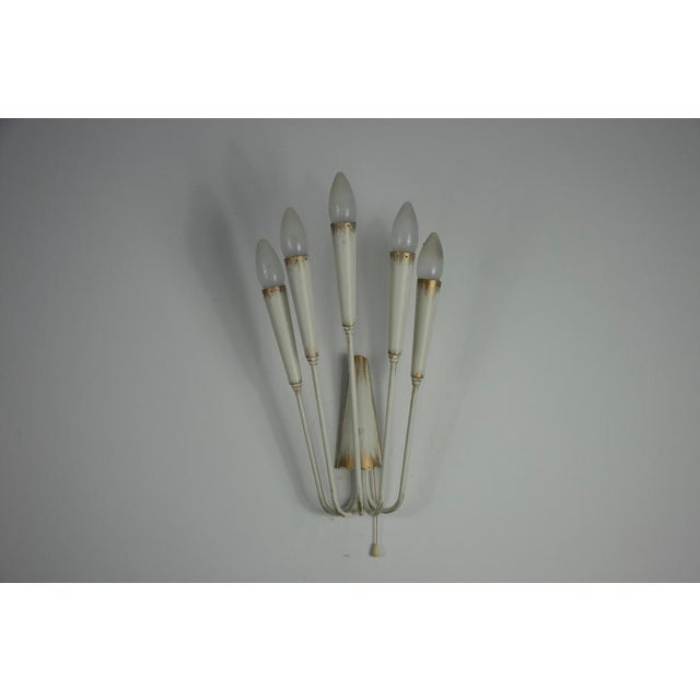 This striking sputnik-style wall lamp from the 1960s is a fine example of mid-century italian design. Made of metal, it...