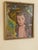A charming mid‑century oil painting depicting a young girl with expressive eyes and flowing brown hair, wearing a...