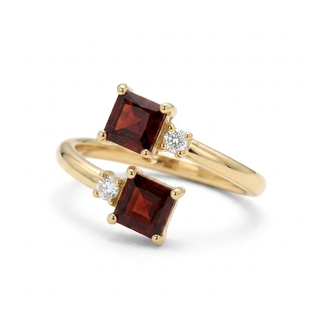Elegant, modern, and deeply romantic. This beautiful "Toi et Moi" (You and Me) bypass ring features two vibrant 4x4mm...