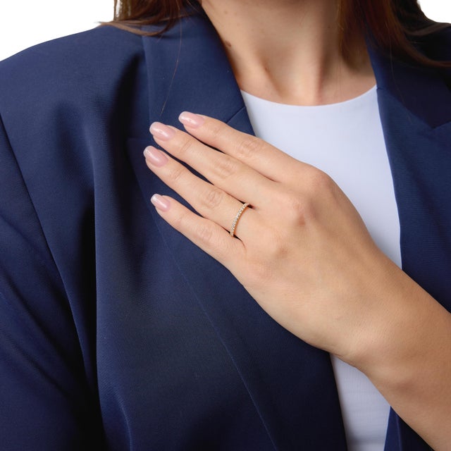 This refined Lugano eternity band showcases a continuous row of bright round brilliant diamonds, offering a seamless...