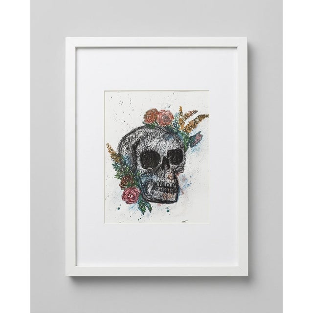 Rather than serving as a symbol of fear, the skull becomes a reflection on transformation, resilience, and the beauty...