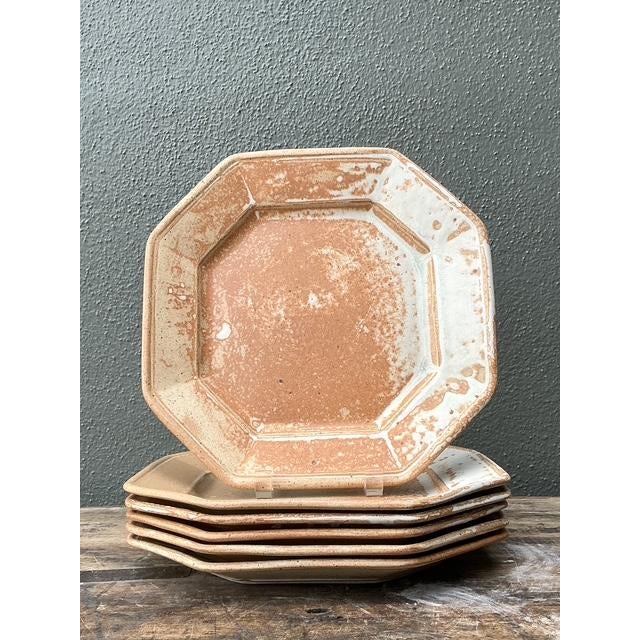 This exceptional set of six vintage dinner plates is a masterclass in geometric design and organic texture. Hand-crafted...