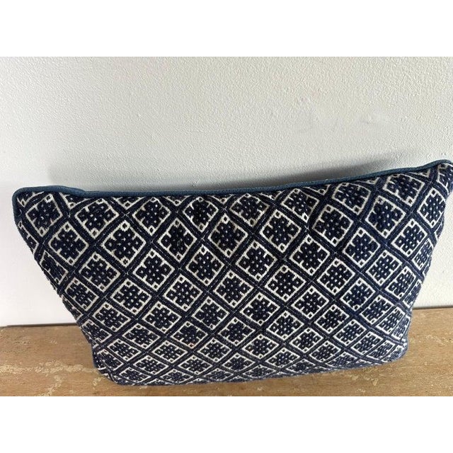 Striking Hmong-inspired tribal textile pillow in deep indigo with a crisp ivory diamond lattice motif. The textile has...