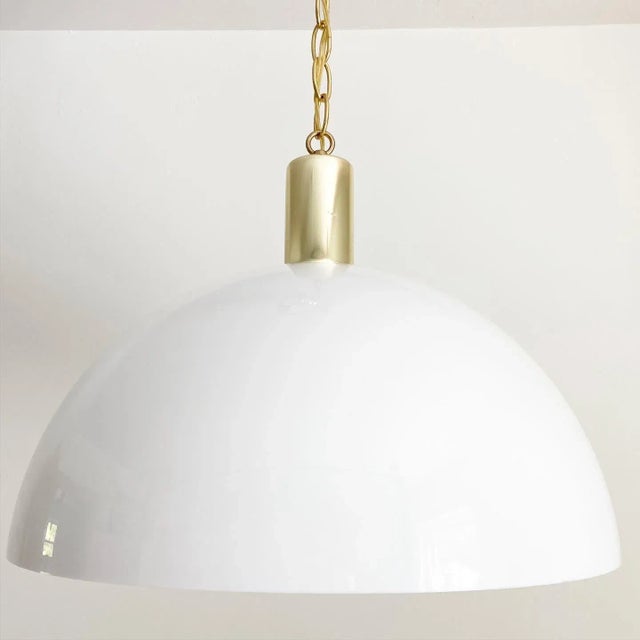 1970s modern minimalist domed white acrylic pendant light in the style of Poulsen by Artcraft Montreal simply topped by a...