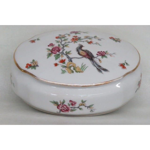 This lovely large dresser box is made of Porcelain. This beautiful piece is stamped as being made by Limoges in France,...