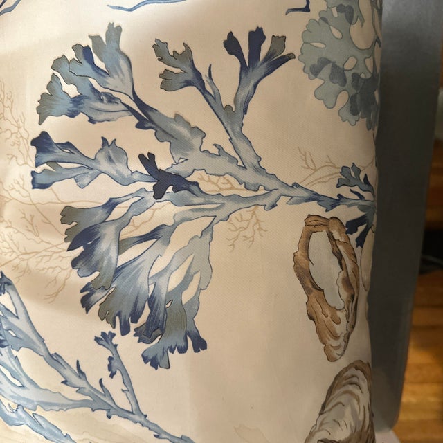 Handcrafted decorative pillow case. Double sided lumbar 13”X24” design with blue ocean plants and light brown shells and a...