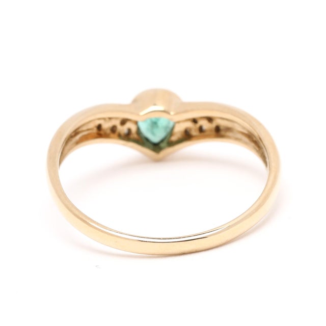 Stones: emerald, 1 stone pear 5 x 3.75 mm approximately .25 carat diamonds, 12 stones round brilliant cut 1.1 - 1.2 mm...