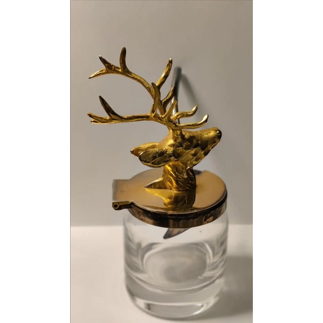 For your consideration. . . A small figural mustard pot in the form of a stag's head. The top of the mustard pot features...