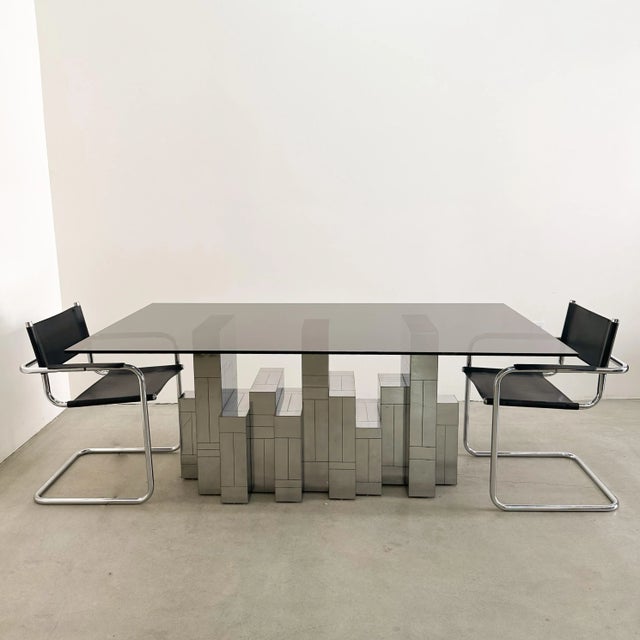Beautiful vintage Mid-Century Modern Paul Evans “Cityscape” dining table in a polished gunmetal finish. The table is...