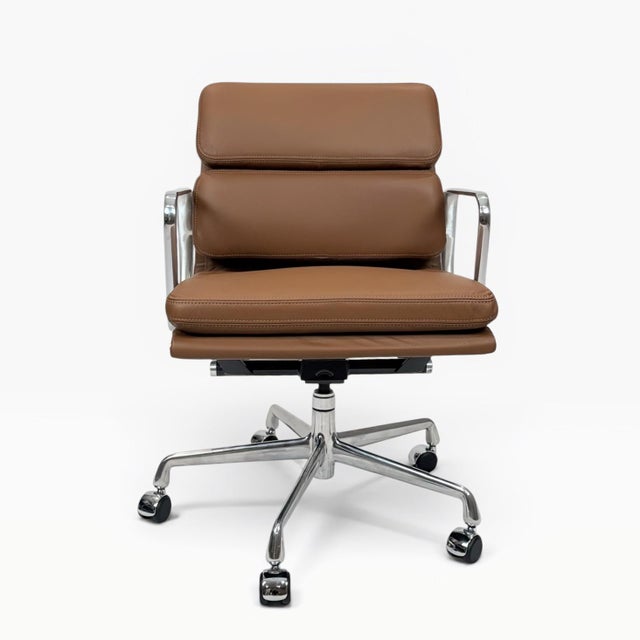 A beautifully restored Eames Aluminum Group Soft Pad Management Chair, originally designed by Charles & Ray Eames....