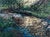 This artwork captures a serene landscape where a gentle stream flows through lush greenery, illuminated by dappled...