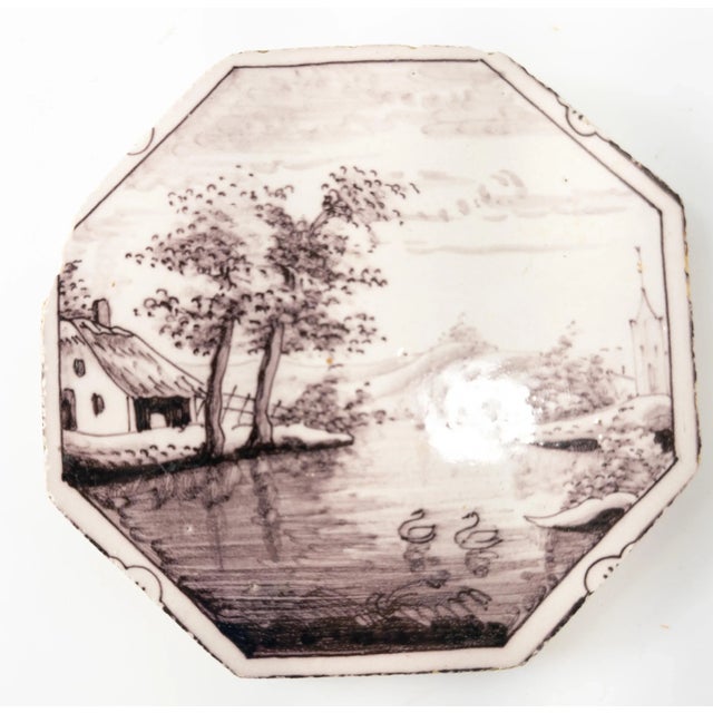 We are selling this English Bristol Delft or Dutch Delf Manganese tile with a landscape with swans in octagonal shape, the...