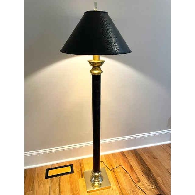 A gorgeous brass column Stiffel floor lamp with faux black lizard shade. The shade is made complete with a decorative gold...