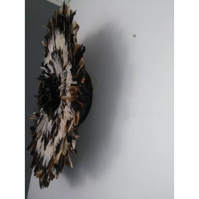 Juju hat natural and white of 31" (80 cm). Juju hat made with natural feathers and rattan. Juju hat woven and handcrafted....