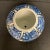 Dated from the mid 20th century. Large ceramic ginger jar. Blue and white coloring with images of Phoenixes, florals and...