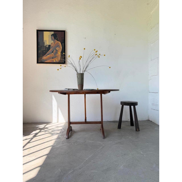 1950s oak winegrower's table with a round folding top. very generously sized, comfortable. stable and sturdy base, with a...