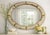 Mid-Century Modern Hollywood Regency Oval Wall Mirror With Brass Accents For Sale - Image 3 of 12
