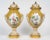 This magnificent pair of covered vases from the early twentieth century is a refined example of the louis xvi style,...