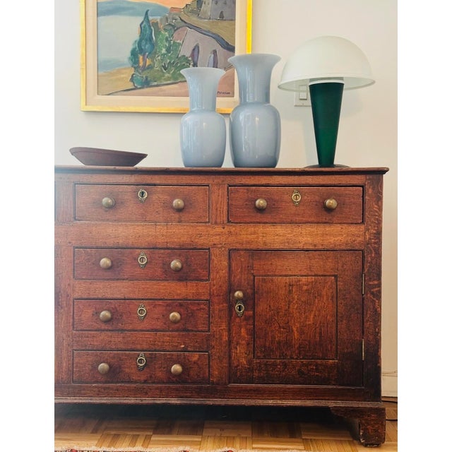 Outstanding George III, 18th century oak Welsh sideboard/dresser having 3 oak lined drawers with brass knob handles, 3 oak...