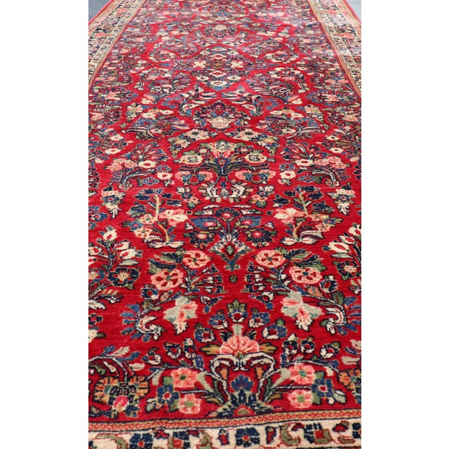Textile Antique Sarouk Long Gallery Runner With All-Over Flower Design in Red Background For Sale - Image 7 of 12
