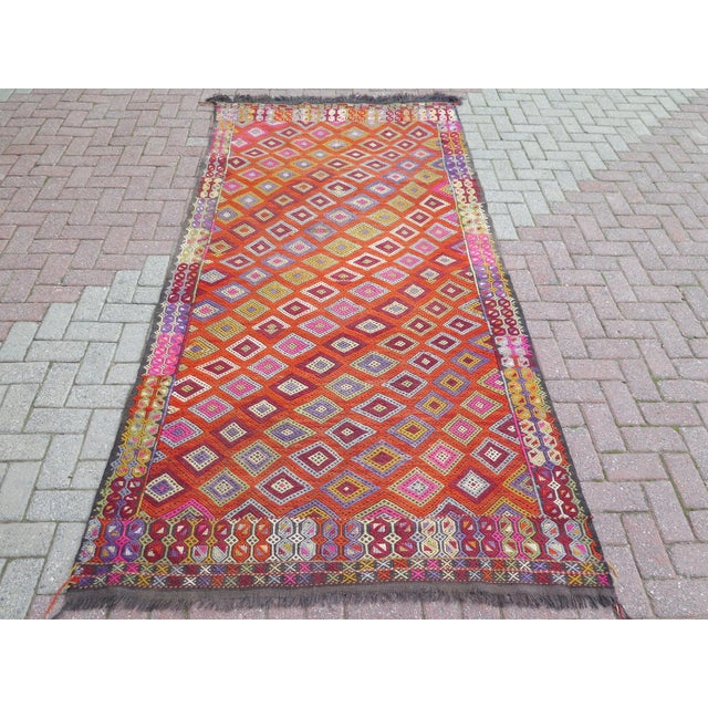 The Kilim Rug you are about to purchase is a Vintage Handmade Turkish Rug that is considered a collection piece due to its...