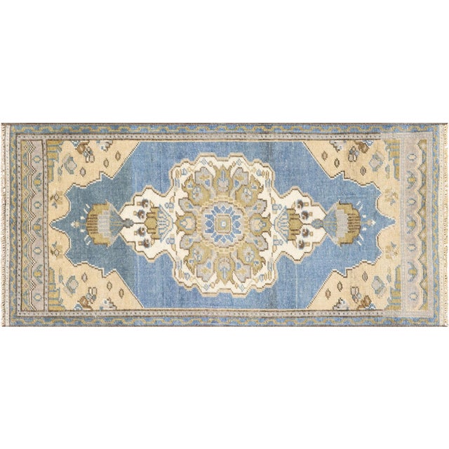 This Vintage Turkish Oushak Yastic rug is a stunning addition to any space. Measuring at 1'7" x 3'7", it boasts rich...