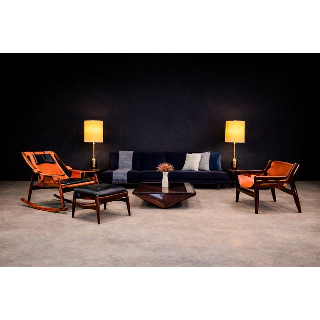 This Brazilian modern rocking chair and ottoman set dates to the 1960s and reflects the refined craftsmanship associated...