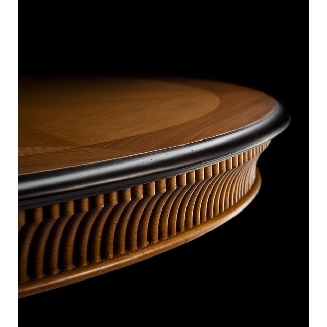 This 72-inch round dining table is handcrafted in Italy and features a striking starburst veneer top that showcases the...