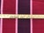 54" wide designer woven stripe upholstery drapery fabric in burgundy red, maroon, plum, and rose. Price is per yard.