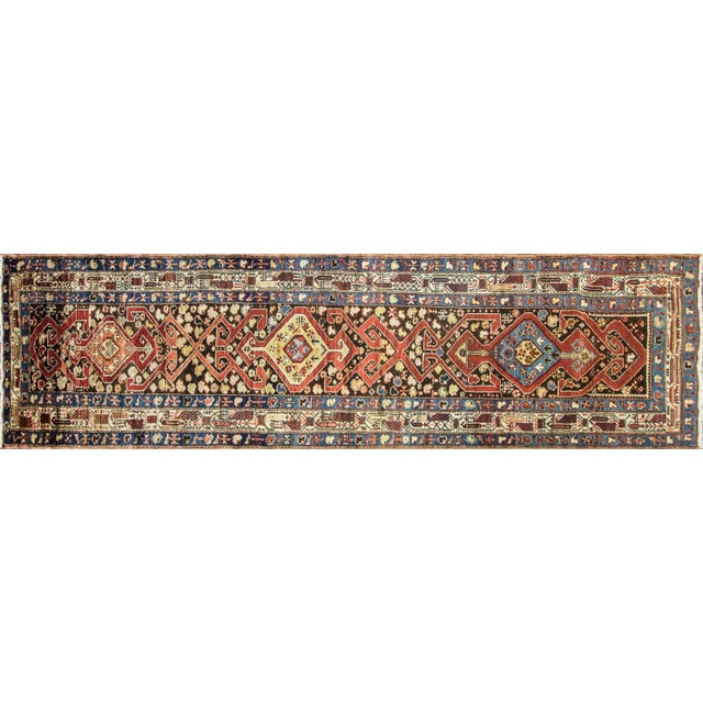 This handsome Antique Northwest Persian runner, woven around 1900, is a striking example of the bold geometric artistry...