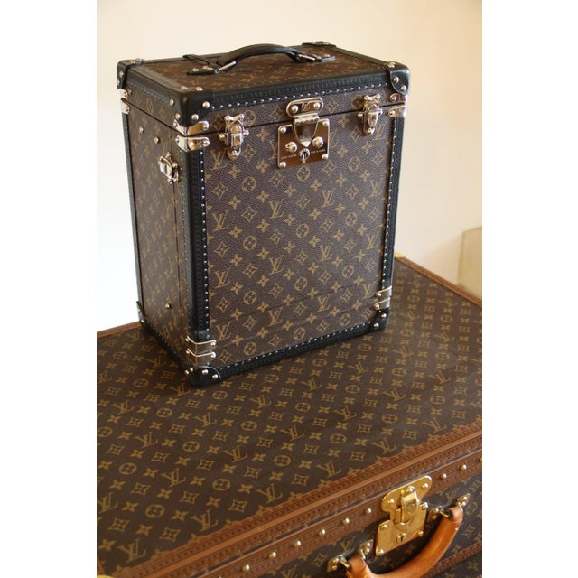 This custom-made Louis Vuitton whiskey trunk is a refined collector’s case, designed to store spirits, whiskey glasses,...