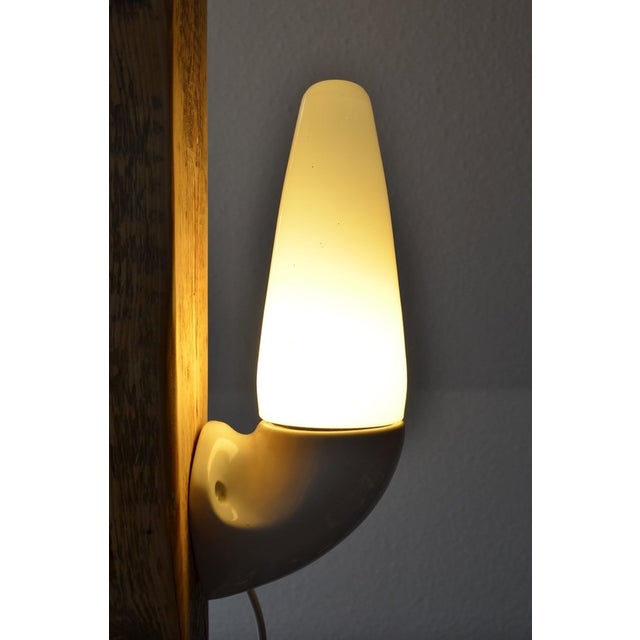 Mid-century ceramic wall lamp by sigvard bernadotte for ifö. The wall lamps are made of white ceramic with an opal glass...