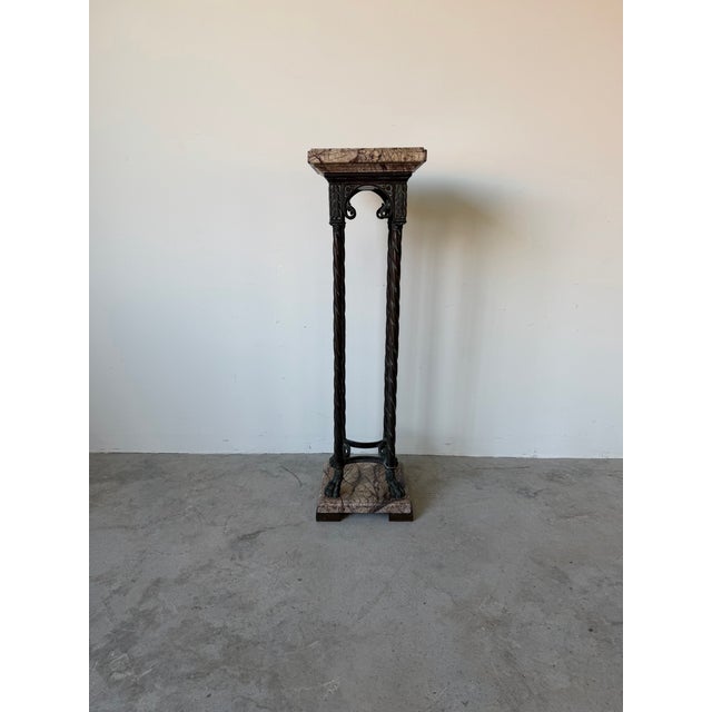 Elegant vintage neoclassical pedestal crafted in solid brass with a richly veined marble top and base. This sculptural...