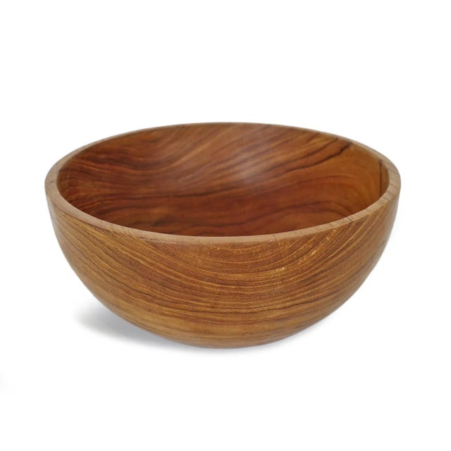 Simple smooth teak wood bowl. Each unique in beautiful natural tones and grain. Each is sold individually.