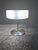 The Mid-century Frost Lamp Shade and Chrome Desk Lamp is a stunning piece with a vintage charm from the 1960s. This...