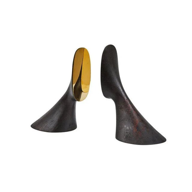 Carl Auböck model #3651 brass bookends. Designed in the 1950s, this incredibly refined and sculptural pair of bookends are...