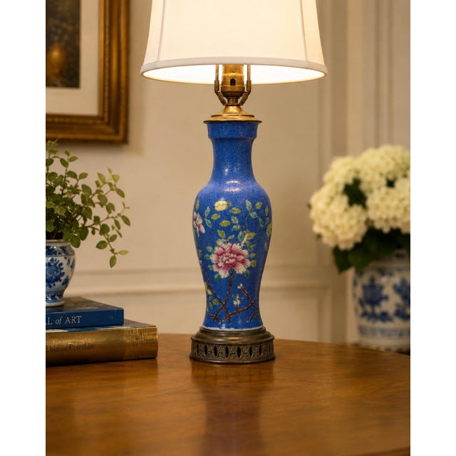 This elegant vintage Chinese porcelain table lamp features a richly colored cobalt blue ground with finely engraved...