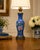 This elegant vintage Chinese porcelain table lamp features a richly colored cobalt blue ground with finely engraved...