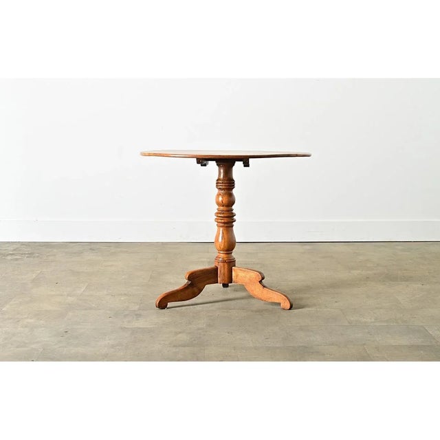 Dimensions: 27 ¾” H x 31” W x 31” D This French pedestal or gueridon table was handcrafted from gorgeous fruitwood circa...