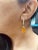 12.84 Carat Fire Opal Diamond Yellow Gold Drop Earrings Item Specs: 2 Faceted Briolette Fire Opal stones weighing...
