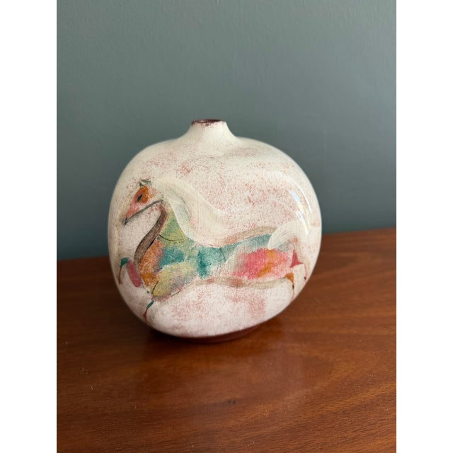 hand-painted Pillin Pottery three-sided vase/weed pot. Decorated with folk-style scenes including a horse, a woman, and a...