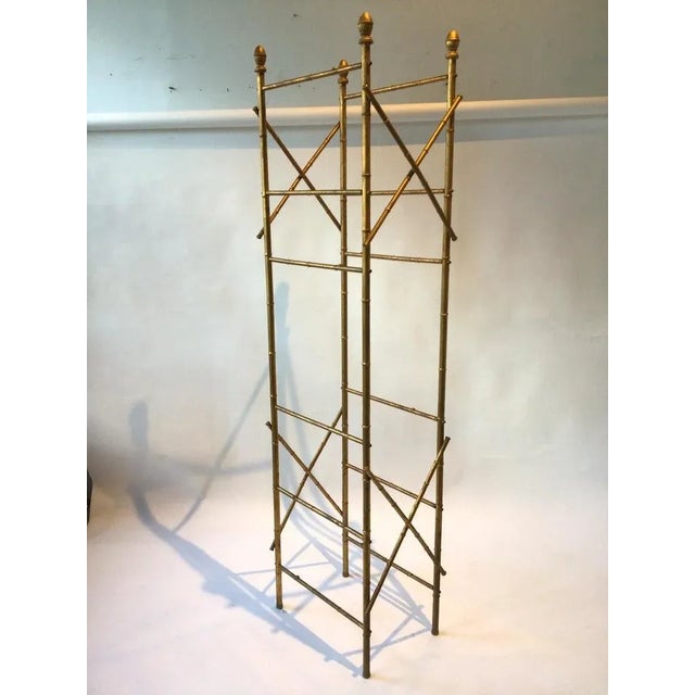 Faux bamboo gilt metal etagere. I’m having new glass shelves made for this piece.