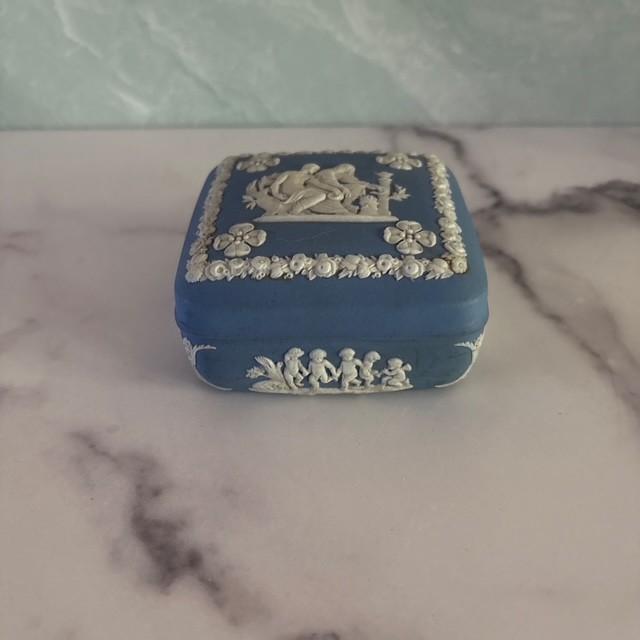 Lovely and graceful classic blue and cream jasperware ceramic box from Wedgwood. Stamped England on reverse. Lidded....