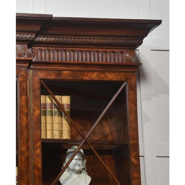 Large George III style mahogany display bookcase the projecting carved molded cornice above four large well-figured...