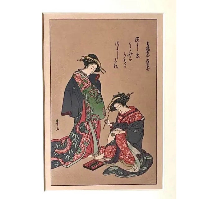 Original antique Japanese miniature woodblock print of Women writing by Kitagawa Utamaro. A printing circa 1900 on rice...