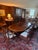 Exceptional complete formal dining suite in the Regency manner, offered as a matched set of table and ten chairs. The...