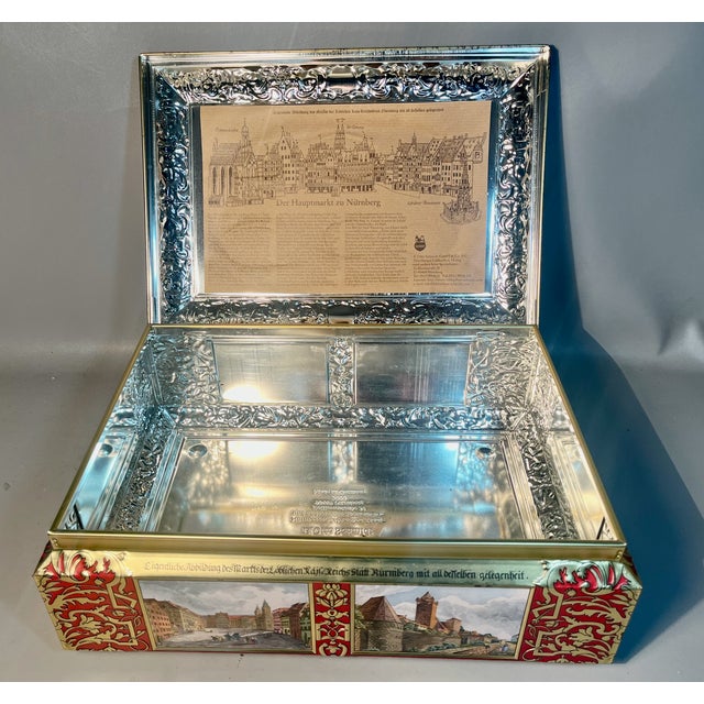 Brought to you from the home of one of the world’s largest Christmas Markets. This lithographed gingerbread cookie tin...