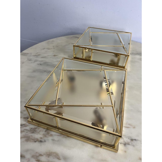 Set of 2 large square 4-light ceiling lights, 1980s, never used. Golden metal and brass structure, frosted glass....